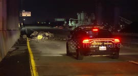 Fatal Crash Occurs When A Solo Vehicle Rollover is Crashed Into Sending Both Over the Side Crash Landing Onto the Freeway Below