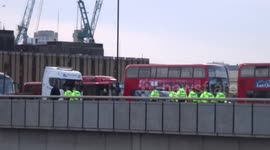 Metropolitan Police officers seen on London Bridge that remains closed for investigation after knife terror attack on 29 November 2019