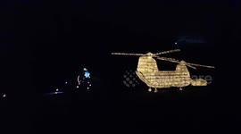 Whaleybridge lantern parade passes the tribute to the RAF CHINOOK and emergency services in park below Toddbrook reservoir