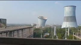 Two thermal power cooling towers demolished in west India