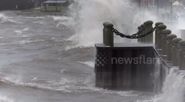 Massive waves pound the shoreline at Spencer Smith Park in Burlington, Ontario as massive ice wind and freezing rain weather bomb hits Canada and the US