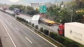 Car narrowly escapes being flattened by shipping container after it falls from truck in China