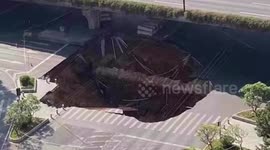 Huge sinkhole opens up on road in southern China
