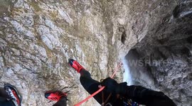 Don't look down! Man abseils down huge canyon waterfall in Austria