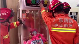 Chinese firefighters free boy trapped inside claw machine after he climbed inside for toys