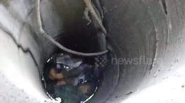 Chinese firefighters hook toddler out of narrow, deep well