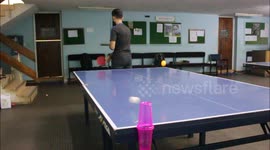 Ping pong whizz performs incredible trick shot without looking