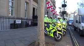 Police escort outside Canada House in Trafalgar Square ahead of NATO reception at Buckingham Palace