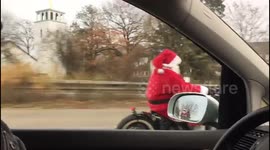 Crew of motorbiking Santas seen riding on streets of Cologne