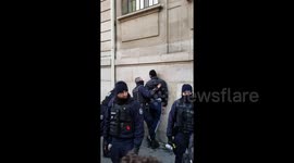 One detained as student protesters clash with police outside high school in Paris