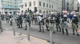 Police stand off against protesters amid a march in Hong Kong.