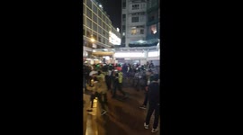 Hong Kong riot police chase off protesters during disorder in Kowloon