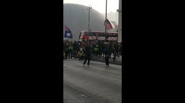 A pro-democracy protester stands off with Hong Kong riot police