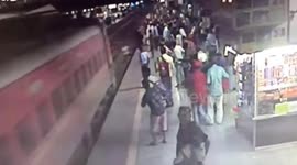 Incredible near-miss for man pushed out of path of oncoming train at Indian station