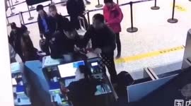 Chinese man violently rips off airport worker's employee card after arguing with her