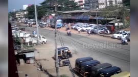 Man suffers seizures while driving; out-of-control car misses pedestrians by a whisker, rams into tuk-tuk and then crashes into lamp post in southern India
