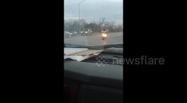Santa riding a motorcycle runs a red light