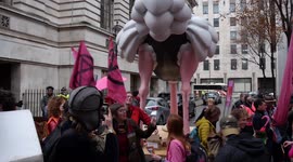 Climate activists place four-metre tall ostrich statue outside Conservative and Liberal Democrat party headquarters