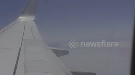 Extremely poor visibility from plane window as smoke from bushfires shrouds Sydney