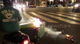 Yellow Vest protesters in Paris set fire to garbage in latest protests