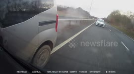 Dashcam records reckless driver ramming other vehicle trying to overtake on UK highway partition