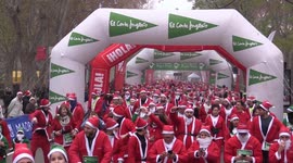 Thousands of Santas race through Spanish capital to raise money for charity