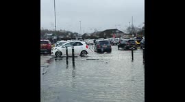Supermarket carpark floods in UK after heavy rain