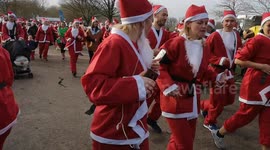 Thousands of Santas run through London park for charity