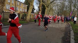 Santa Run: Thousands take part in charity Christmas race in London