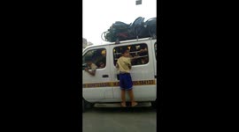 Police arrest bus driver after boy forced to travel to school hanging from van