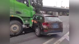Chinese motorist jumps out of car to escape after being crashed into and dragged forward by truck