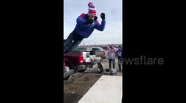 Terrifying moment Buffalo Bills fan nearly breaks neck in reckless jump onto table outside stadium