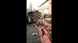 Eyewitness captures carnage after car flips into house in Salford, England