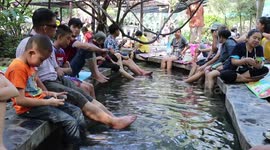 Locals bathe in hot spring as temperatures fall to -1C in parts of northern Thailand