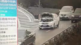 Electric car driven along busy road for 10-miles with bonnet up in China