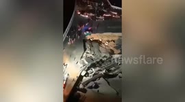 Moment two cars get swallowed up by huge sinkhole in China