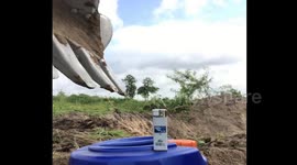 Incredible skills of digger driver who uses excavator arm to light a lighter