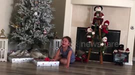 Toddler throws adorable tantrum at having to wait to open Xmas presents