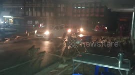 Huge group of wild monkeys scatters when they hear fireworks in Thailand