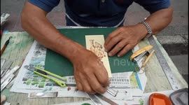 Talented street artist draws great painting at street of Penang Malaysia