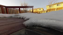 Home-owner films snow melting timelapse on sunny east Canada day
