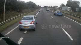 Stupid driver pulls out in front of HGV