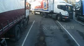 Stupid HGV driver takes off part of another truck while getting out of tight spot at service station in Wales