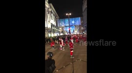 Roads in central London shut down by skating Santas