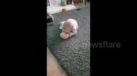 Hilarious moment confused baby tries to suck milk out of fake boob