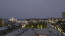 Sydney opera house and city skyline at night