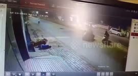 Miraculously survive Two bike-borne men hit by a car after which one of them was dragged in India.