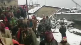 Despite heavy snowfall wedding procession marches through blizzard-struck northern India