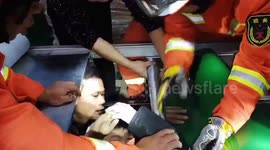 Chinese firefighters free boy's arm after it became trapped in factory conveyor belt