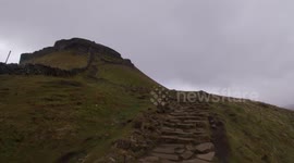 Huskies climbing Pen-Y-Ghent in a storm